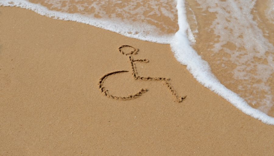 a universal wheelchair access symbol drawn in the sand